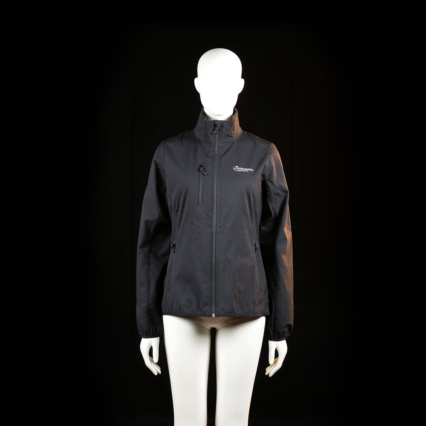 Furuboda Assistans - Rain jacket - Black - Size M - Lightweight jacket with a high collar, full front zip, and zippered pockets on both sides and chest. Features elastic cuffs and a smooth, water-resistant surface.